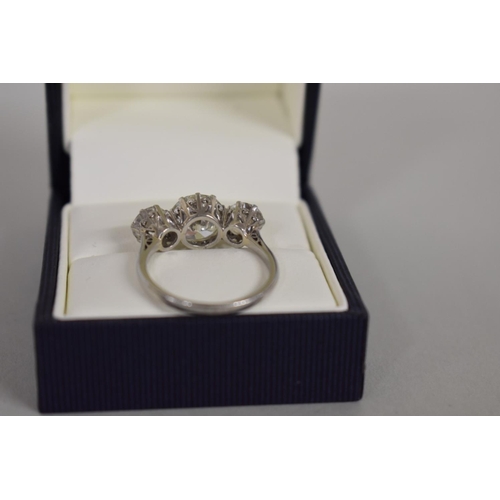 291 - An old European cut diamond and platinum three stone ring, the central stone 2.6ct, colour J/K, clar... 