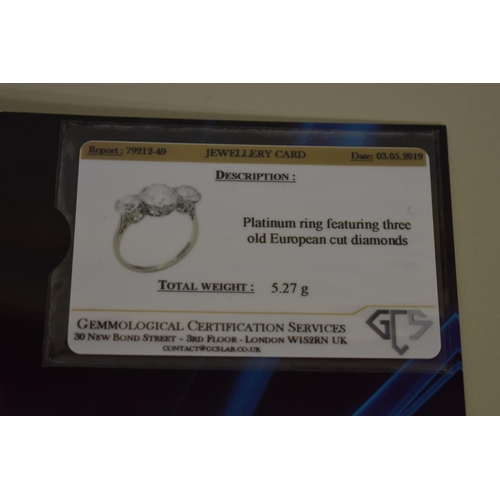 291 - An old European cut diamond and platinum three stone ring, the central stone 2.6ct, colour J/K, clar... 