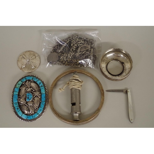 110 - A group of silver and metal items, to include: a Native American buckle; and silver chains.... 