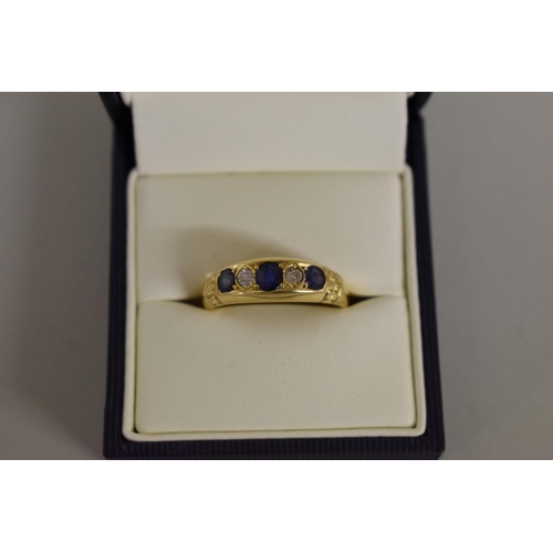 274 - An 18ct gold sapphire and diamond gypsy ring.