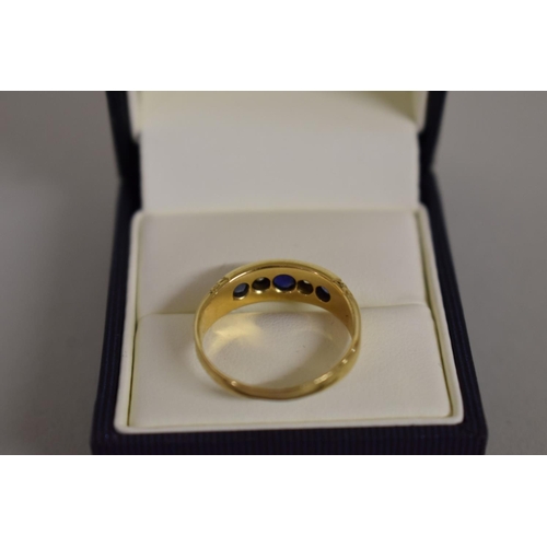 274 - An 18ct gold sapphire and diamond gypsy ring.