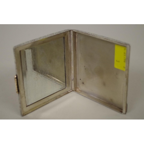 35 - A German engine turned .800 white metal cigarette case, having unmarked yellow metal clasp and mirro... 