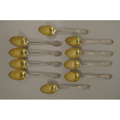 83 - A set of ten Victorian decorative silver teaspoons, having Neptune finials and gilt shell bowls, by ... 