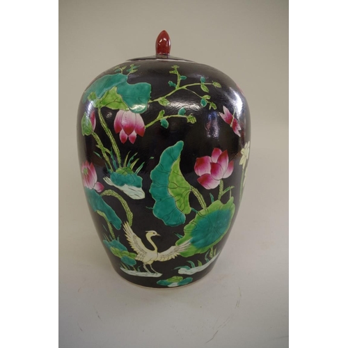 1309 - A Chinese black ground famille noir ovoid jar and cover, seal mark to base, 31cm high.... 