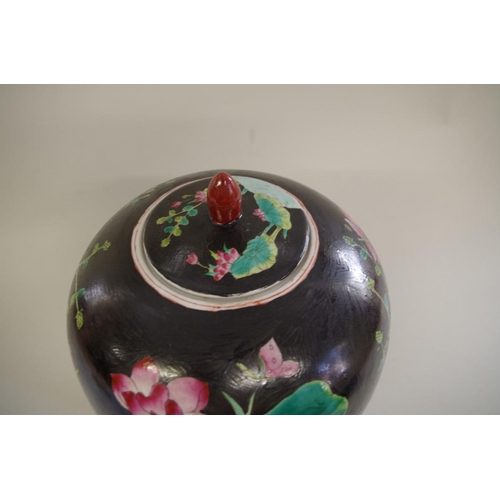 1309 - A Chinese black ground famille noir ovoid jar and cover, seal mark to base, 31cm high.... 