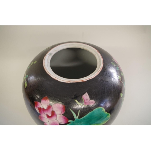 1309 - A Chinese black ground famille noir ovoid jar and cover, seal mark to base, 31cm high.... 