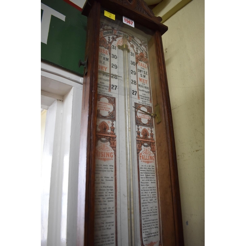 1311 - A carved oak Admiral Fitzroy barometer, 112cm high.