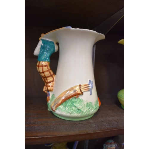 1625 - A 1930s Burleigh ware Golfer jug, 19.5cm high.