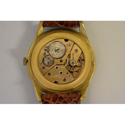 A vintage gold plated Ulysse Nardin manual wristwatch movement