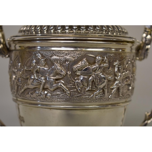 17 - A silver twin handled cup and cover, by C S Harris & Sons Ltd, London 1914, the frieze depicting... 