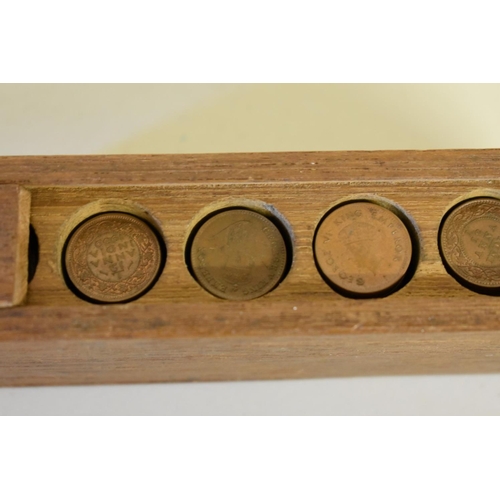 194 - Coins: a quantity of George V & George IV 1/12 Anna copper coins, in a wooden storage box.... 