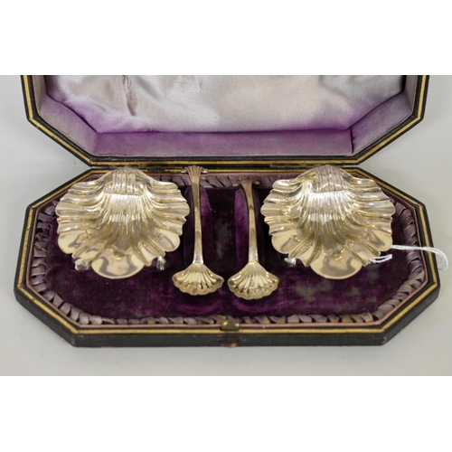 24 - A cased pair of Victorian silver salts and spoons, by  George Unite, Birmingham 1884, 78.5g.... 