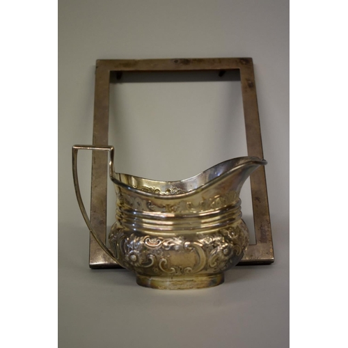 59 - A silver embossed milk jug, by Thomas Bradbury & Sons, Sheffield 1901, 9.5cm high, 175g; to... 