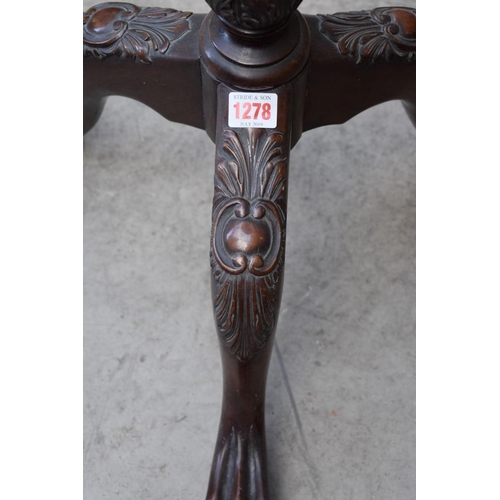 1278 - A carved mahogany tripod torchere, 103cm high.