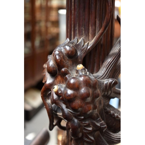 1283 - A Chinese carved hardwood standard lamp, lacking fitting, 152.5cm high. 