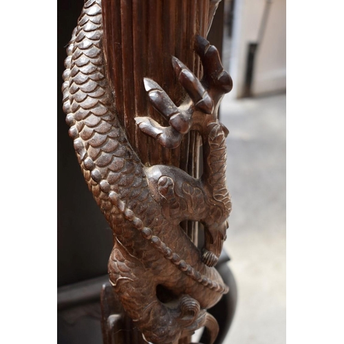 1283 - A Chinese carved hardwood standard lamp, lacking fitting, 152.5cm high. 