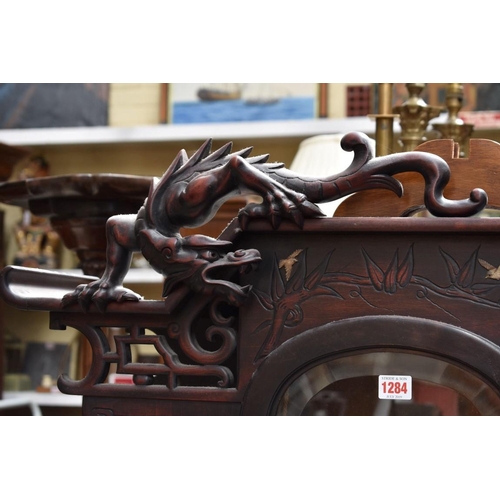 1284 - A late 19th century Japanese carved and inlaid display cabinet, 175cm high.