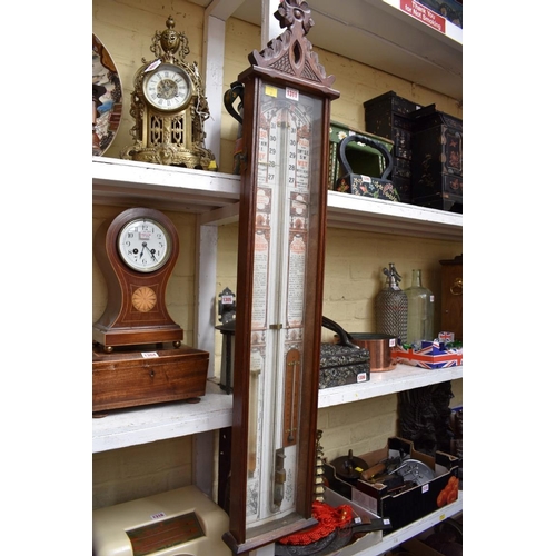 1311 - A carved oak Admiral Fitzroy barometer, 112cm high.