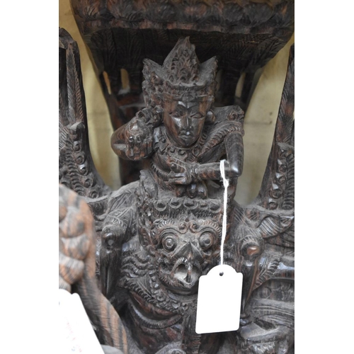 1319 - A Thai carved hardwood figure group, 40cm high; together with another similar smaller example. ... 