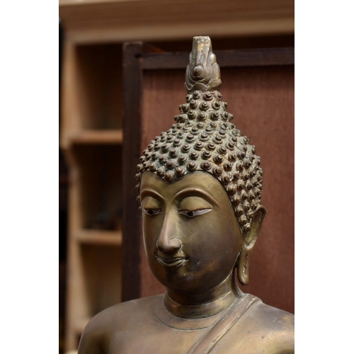 1334 - A Sino-Tibetan bronze Buddha, 54cm high.