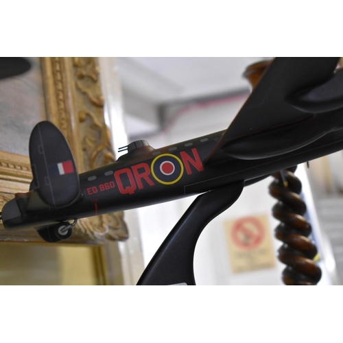 1351 - A carved and painted mahogany 1:72 scale model of a Lancaster Mark I aeroplane, by Bravo Delta model... 