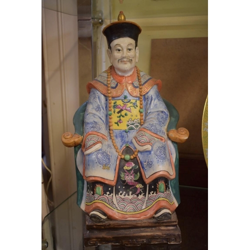 1354 - Two Chinese famille rose figures of seated officials, 35.5cm high.