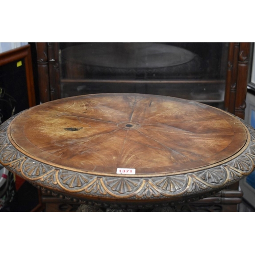 1371 - An unusual 19th century carved walnut circular centre table, 58cm diameter. ... 