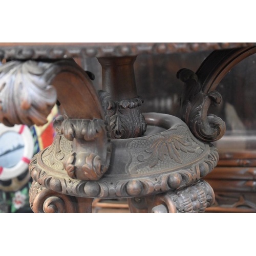 1371 - An unusual 19th century carved walnut circular centre table, 58cm diameter. ... 