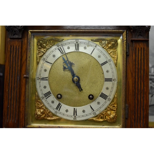 1388 - An Edwardian oak architectural mantel clock, 41.5cm high.