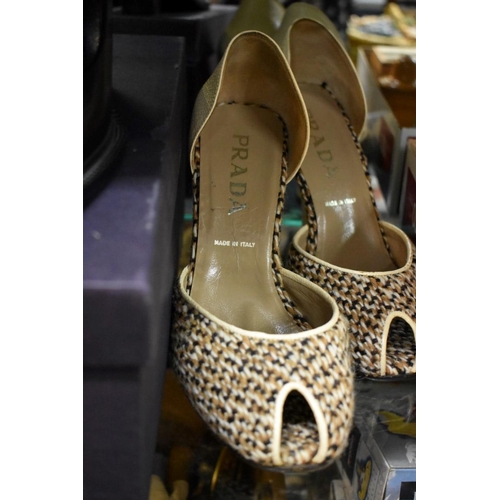 1394 - Two pairs of Prada shoes, sizes 38 and 38.5 respectively, each with bag, one pair boxed.  ... 