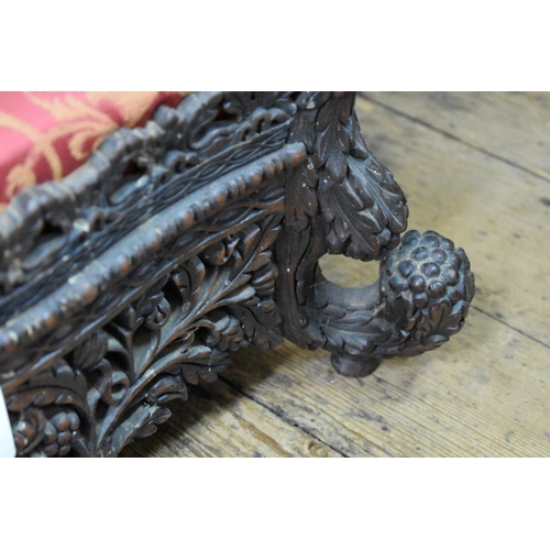 1424 - A 19th century Anglo-Indian carved and pierced hardwood foot stool.