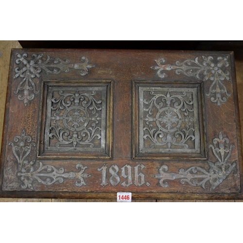 1446 - A Victorian stained oak and metal strapwork casket, dated 1896, 55.5cm wide.