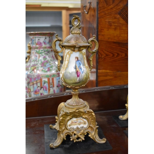 1452 - A late 19th century gilt metal and porcelain mounted clock garniture, the clock 42.5cm high, wi... 