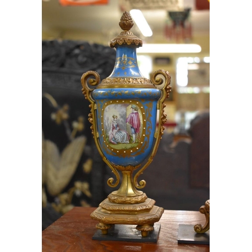 1459 - A late 19th century gilt metal and Sevres style porcelain clock garniture, the clock 39.5cm high, wi... 