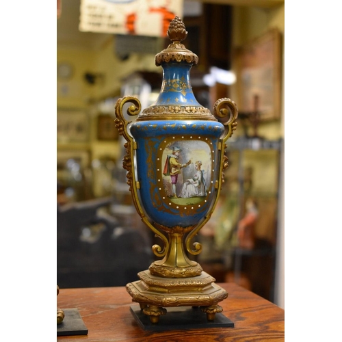 1459 - A late 19th century gilt metal and Sevres style porcelain clock garniture, the clock 39.5cm high, wi... 