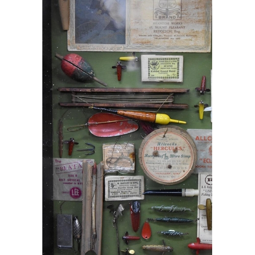 1468 - Angling: a framed display of fishing items, 63.5 x 79.5cm.