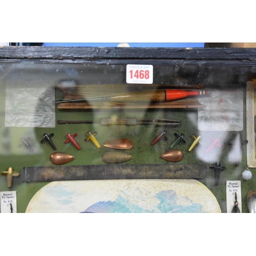 1468 - Angling: a framed display of fishing items, 63.5 x 79.5cm.