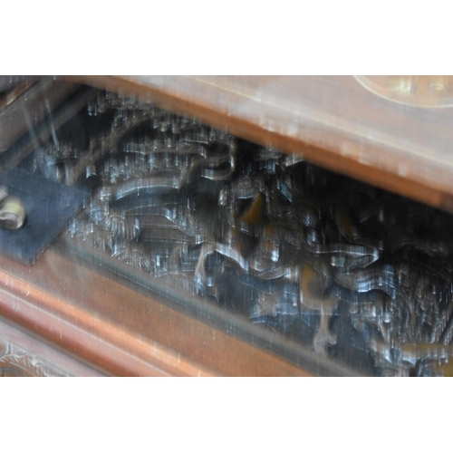 1476 - A Chinese carved hardwood occasional low coffee table, 94.5cm wide. 