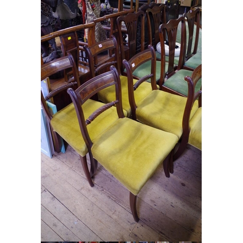 1494 - A set of six Regency mahogany and brass strung sabre leg dining chairs. 