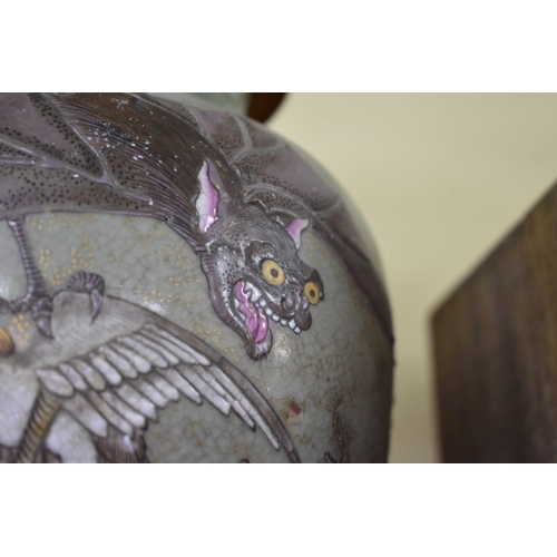 1544 - A Japanese Satsuma pottery vase and cover, painted with a bat and mythical birds, 39.5cm high, ... 