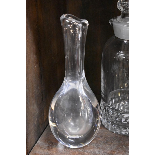 1572 - Four items of glass, comprising: an Orrefors clear glass decanter and stopper; two similar Kost... 