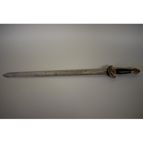 1680 - A Chinese Jian or short sword, having 45cm blade and brass mounted hardwood handle, the shagreen sca... 