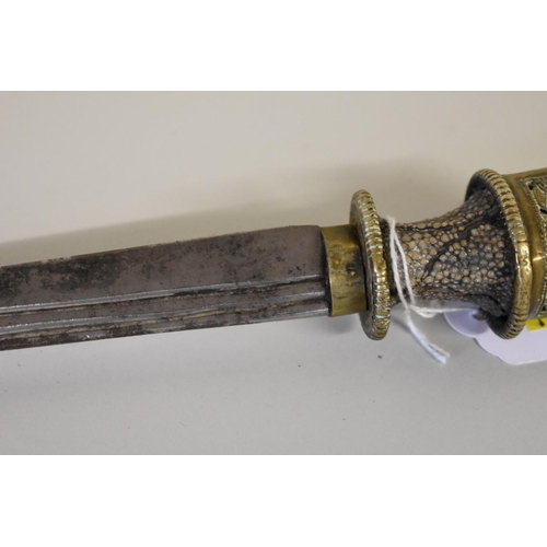 1690 - A Tibetan dagger, having 27cm fullered steel blade with brass mounted shagreen hilt and brass mounte... 