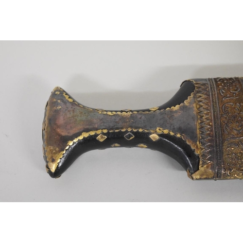 1698 - An Arab jambiya and sheath, inscribed 'National Drilling Company', 14cm blade.