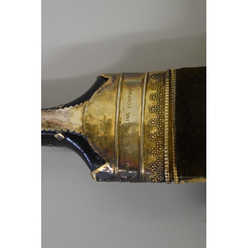 1698 - An Arab jambiya and sheath, inscribed 'National Drilling Company', 14cm blade.