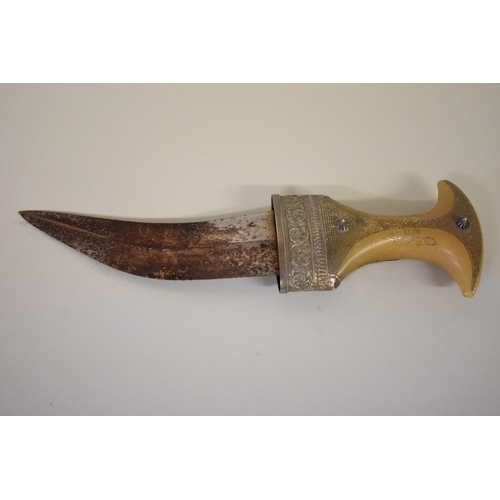 1699 - An Arab horn handled and white metal mounted jambiya and sheath, 17cm blade.