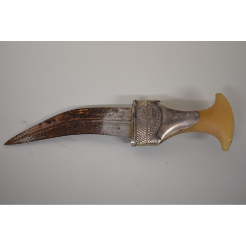 1699 - An Arab horn handled and white metal mounted jambiya and sheath, 17cm blade.