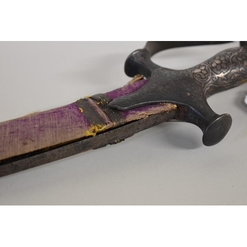 1706 - A North Indian short Tulwar sword, with a Khukuri Notch, having 40cm gilt decorated blade, and scabb... 