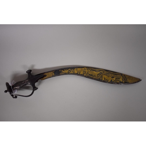 1706 - A North Indian short Tulwar sword, with a Khukuri Notch, having 40cm gilt decorated blade, and scabb... 