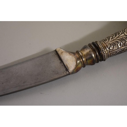 1719 - An Indo-Persian dagger, having 18.5cm Damascus blade, white metal rams head handle and velvet s... 